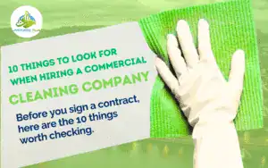 Cover graphic for a guide on 10 things to look for when hiring a commercial cleaning company by Janitorial Plus, illustrating a gloved hand wiping a clean surface.